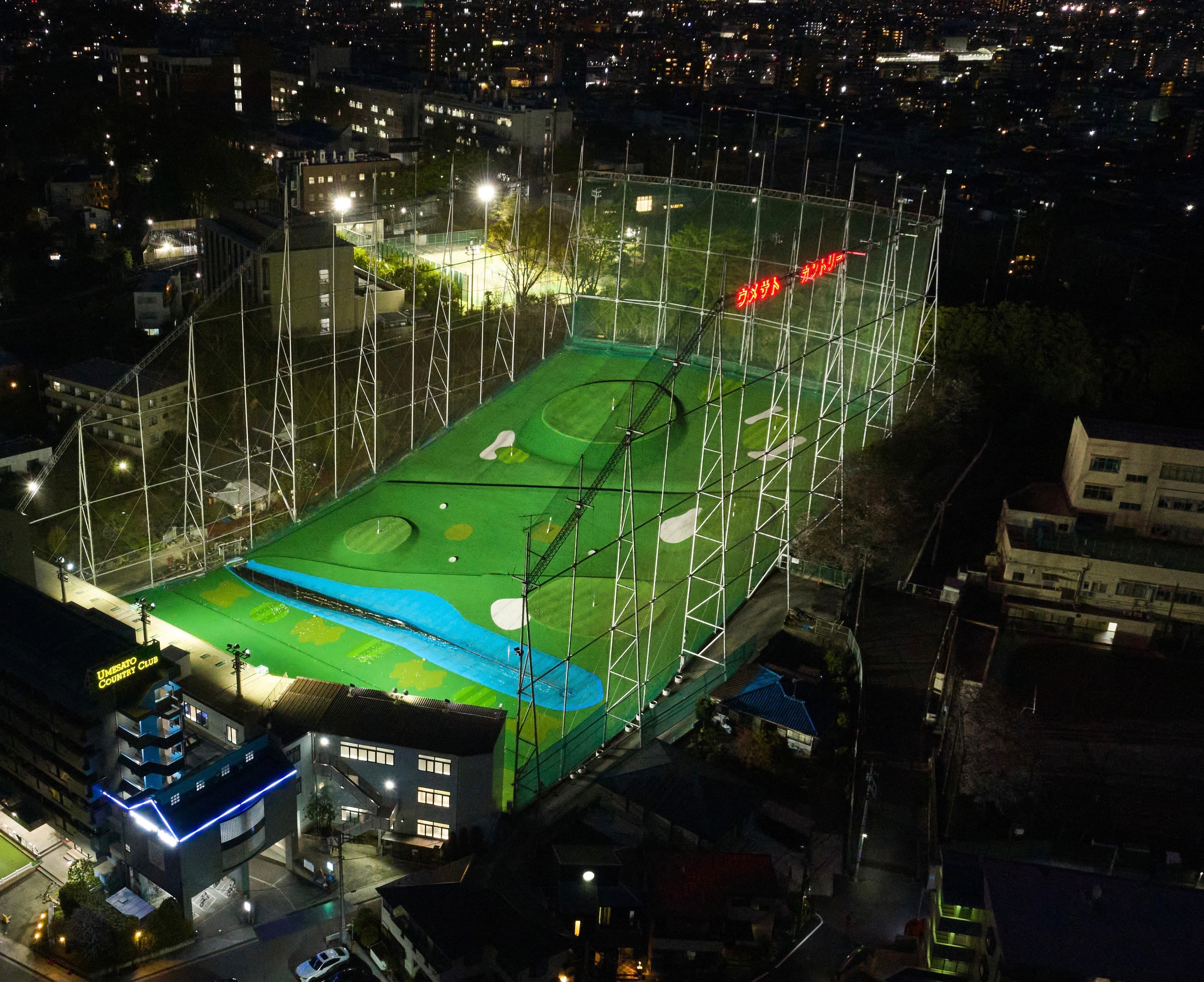 Aerial view of Umesato Country Club driving range at night