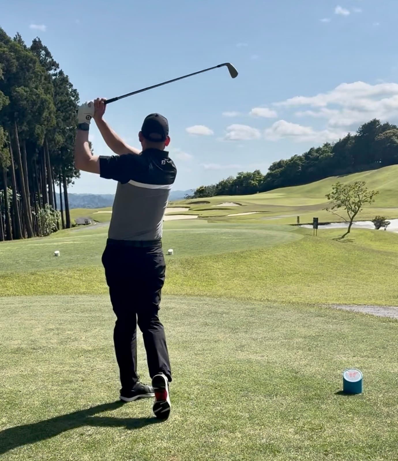 Golfer on the follow-through at Umesato Country Club